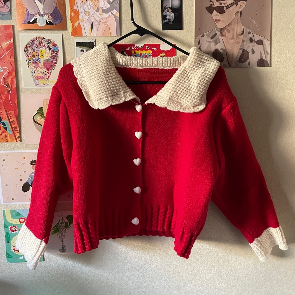 red and white knit sweater with heart buttons